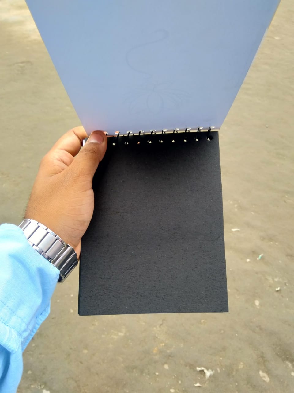 BLACK NOTEBOOK OUTSIDE